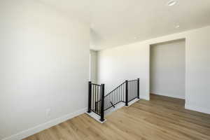 Upstairs landing with light wood-type flooring. 2411 S.