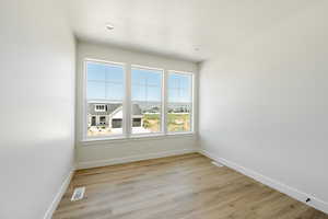 Upstairs room with light wood-type flooring. 2411 S.