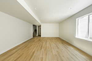 Basement family room featuring light wood-type flooring. 2411 S.