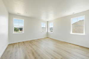 Owner's suite with light wood-type flooring. 2411 S.