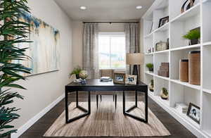 Office area with dark hardwood / wood-style flooring