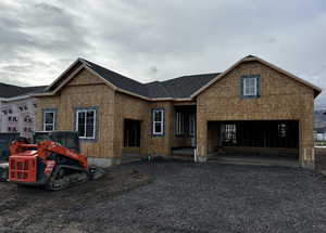 Property under construction with a carport