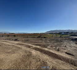 Property view of mountains featuring a rural view