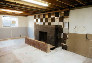 Basement featuring a fireplace