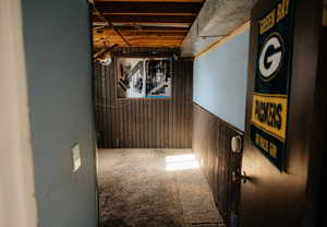 Interior space with wood walls and carpet floors