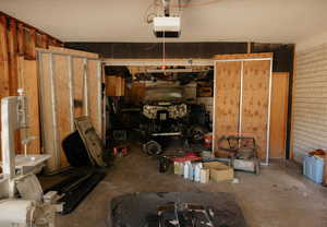 Garage featuring a garage door opener