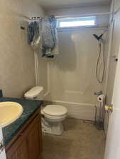 Full bathroom with tile patterned flooring, vanity, toilet, and bathtub / shower combination