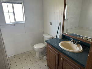 Bathroom featuring vanity and toilet