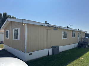 View of home's exterior with a lawn