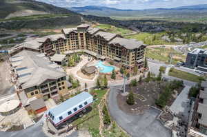 Birds eye view of property with a mountain view