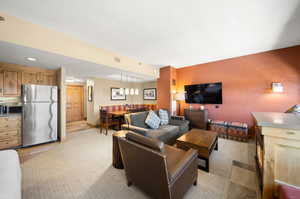 Living room featuring light colored carpet