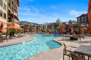 View of swimming pool with a patio area