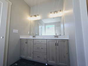 Bathroom with vanity and tile patterned flooring