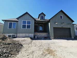 View of front facade featuring a garage