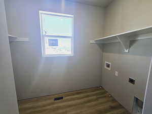 Laundry area featuring washer hookup, dark hardwood / wood-style flooring, and electric dryer hookup