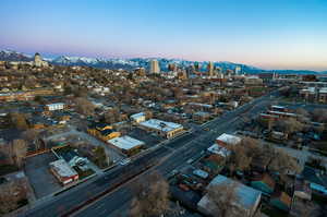 Aerial view at dusk featuring a mountain view