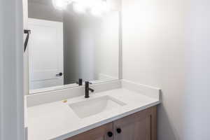 Half Bath with Moen Faucets and Custom Cabinet Vanity