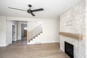 Custom Stone fireplace with floating wood mantel.