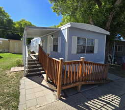 View of front of property featuring a carport