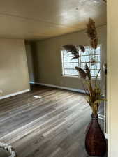 Unfurnished room with hardwood / wood-style floors