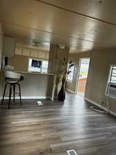 Kitchen featuring a kitchen bar and light hardwood / wood-style flooring