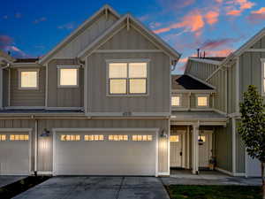 View of front facade featuring a garage