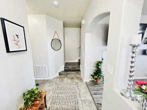 ENTRY TO TOWNHOME BOASTS FRESH PAINT, DURABLE LVP AND VINYL TILE