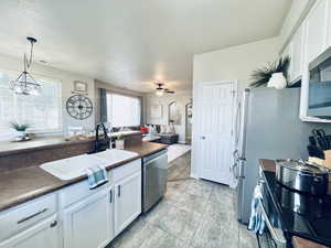 VERY FUNCTIONAL KITCHEN ALSO BOASTS CLOSET PANTRY FOR MORE STORAGE