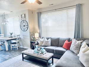 LARGE WINDOWS WITH BLINDS OFFER LIGHT AND PRIVACY WHEN NEEDED