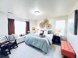 LARGE WINDOWS OVERLOOK THE GREEN SPACE AND WALKING TRAILS BEHIND TOWNHOME