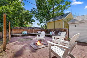 View of patio / terrace with an outdoor fire pit