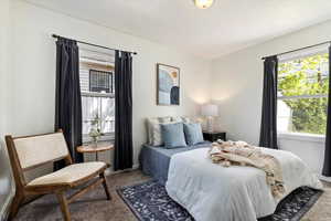 Bedroom with light colored carpet