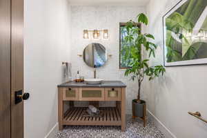 Bathroom featuring vanity and tile patterned flooring