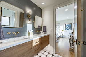 Bathroom with vanity and hardwood / wood-style floors