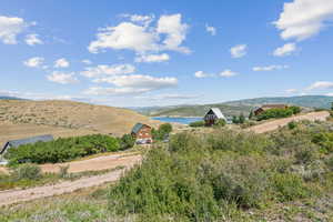 Property view of mountains featuring a water view