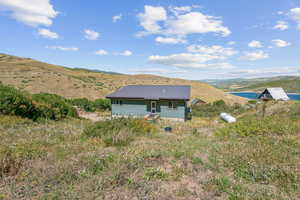 View of side of home featuring a mountain view