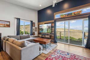 Living room featuring hardwood / wood-style floors and ceiling fan