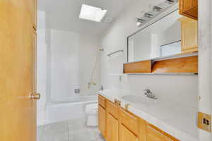 Full bathroom with cabinet storage