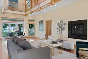 Seating area with fireplace, natural light and views