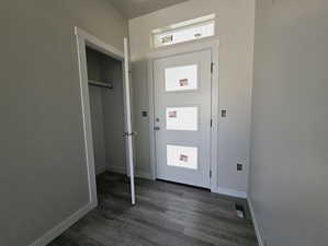 Interior space featuring dark wood-type flooring