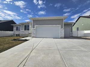 View of front of home featuring a garage