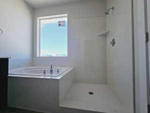 Bathroom featuring plus walk in shower