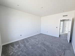 Empty room featuring carpet flooring