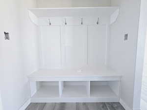 Mudroom with hardwood / wood-style flooring