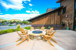 View of patio / terrace with a mountain view and a fire pit