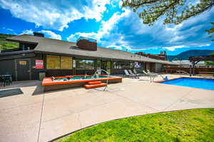 View of swimming pool featuring a mountain view and a patio