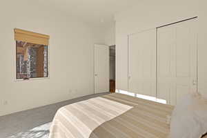 Carpeted bedroom featuring ornamental molding, a closet, and baseboards