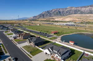 Aerial view featuring a rural view and a water and mountain view