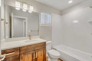 Full bathroom with shower / tub combination, toilet, and vanity