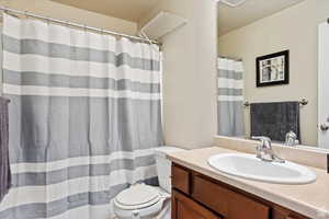 Bathroom featuring vanity and toilet